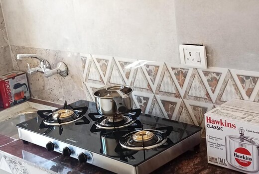 Hill Town Apartment Caretaker and Kitchen