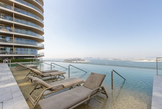 ELIVAAS Curated Designer 1BR at Emaar Beachfront | Beach Acces