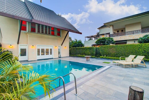 StayVista at Ekant Villa w/ Bonfire & Outdoor Pool