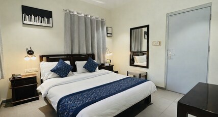 Hotel Marigold With Swimming Pool by SAH Room Type - Deluxe AC room