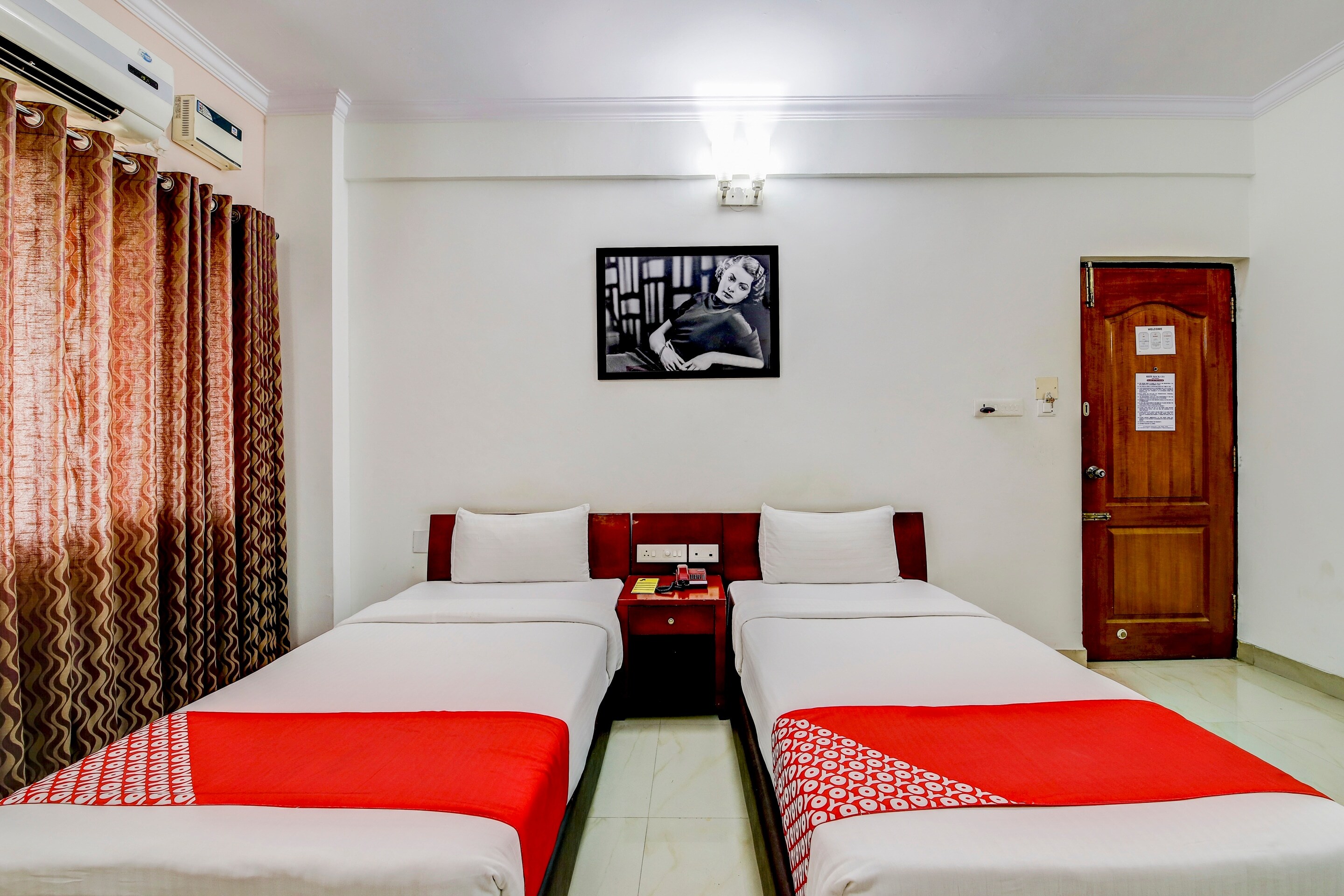 OYO White Brick's Inn, Near Palace Grounds. - Tap to explore photos