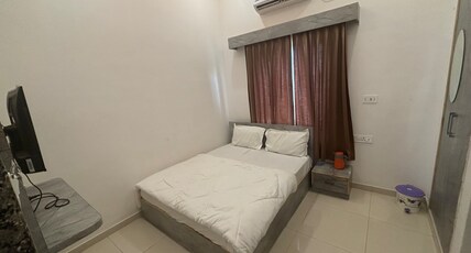 Pujari Guest House. Room Type - Deluxe Room