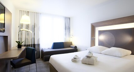 Novotel Basel City Room Type - Family Room with a queen size bed and sofa bed