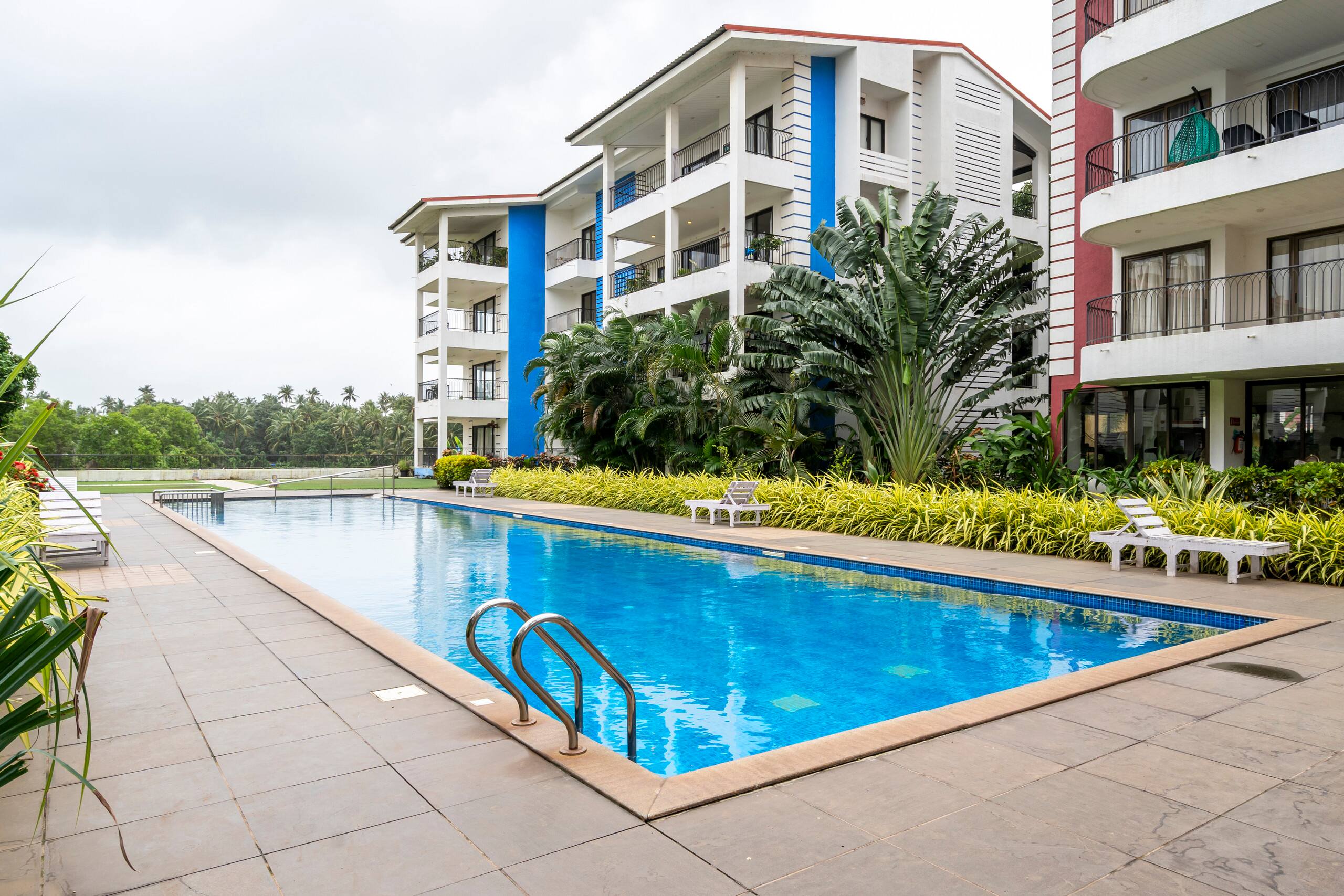 Staymaster SurfShore 2BR w Pools Gym in Baga - Tap to explore photos