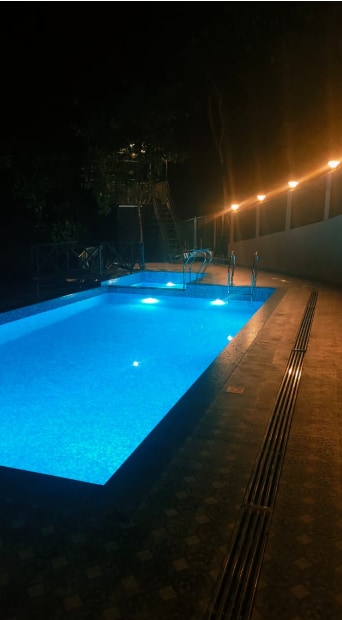 Mizzle Premium Resort in front of Banasura Dam - Tap to explore photos