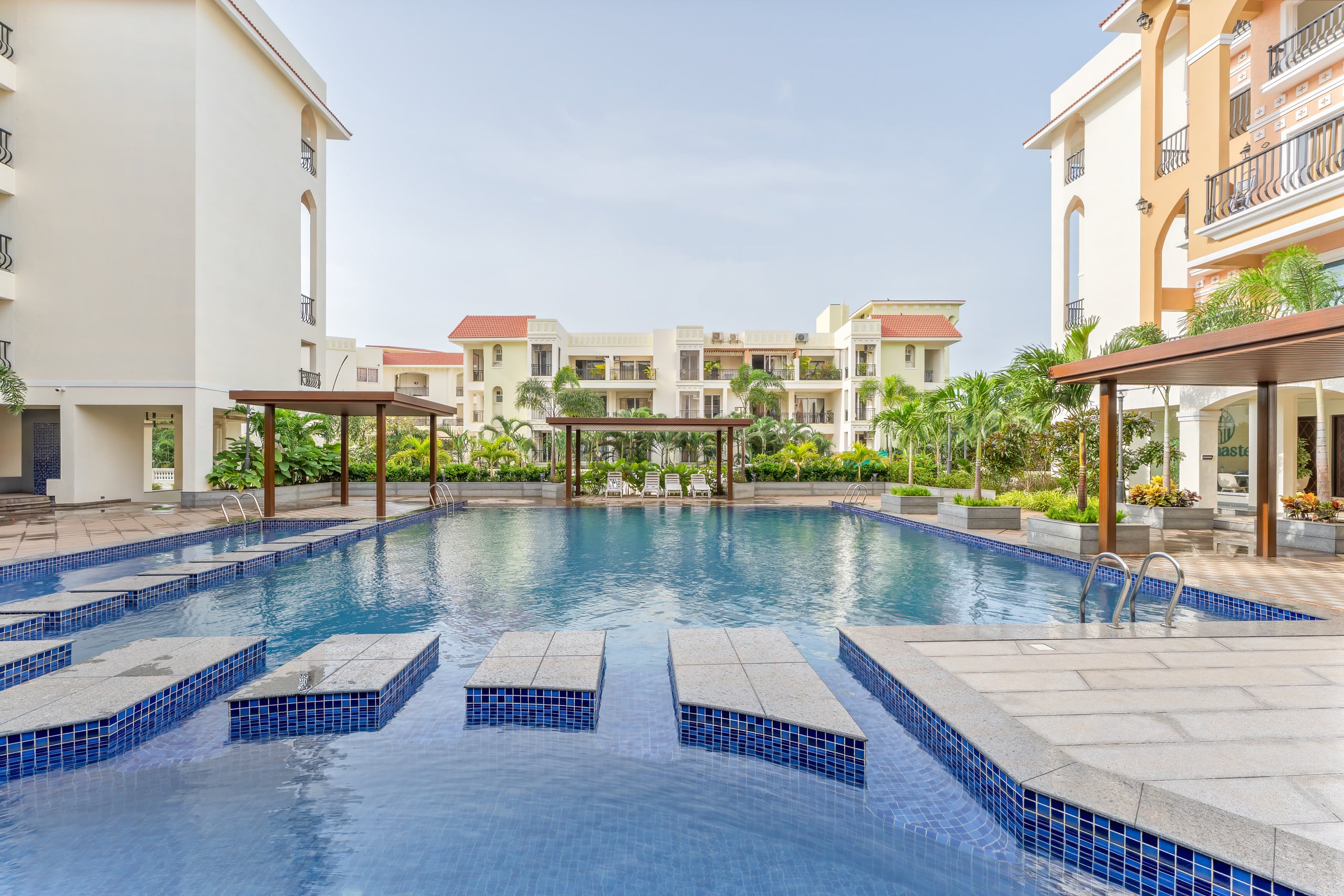 Sereno Pebbles 2 - cosy 1bhk w/pool, gym, games - Tap to explore photos