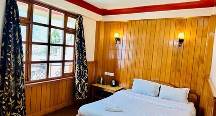 Cliff View Residency Room Type - Deluxe Room with Mountain Cliff and Waterfall View