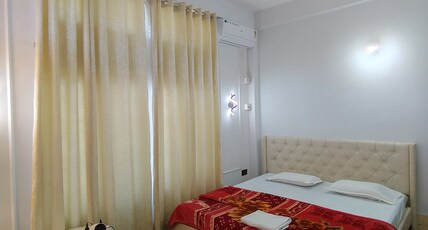 Aarna Homestay Room Type - white Room With Common living Room & Kitchen