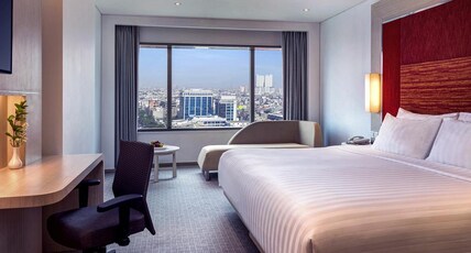 Grand Mercure Jakarta Harmoni Room Type - Grand Deluxe Room with 2 Queensize bed and Sofa Grand Mercure Jakarta Harmoni Room Type - Grand Deluxe Room with 2 Queensize bed and Sofa