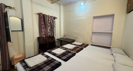 Golden Lodge Room Type - FOUR BED NON AC ROOM WITH COMMON BATHROOM