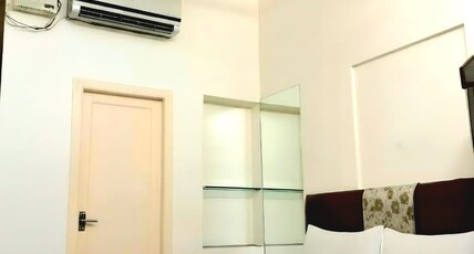Nivi Residency Room Type - Deluxe AC Room