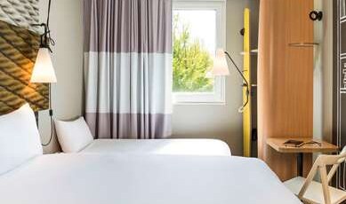 ibis Saint Denis Stade Sud Room Type - Standard Room with one double bed and one single bed ibis Saint Denis Stade Sud Room Type - Standard Room with one double bed and one single bed