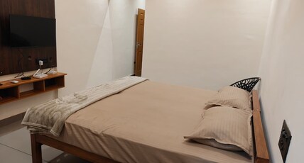 Nayo Residence Near Padmanabhaswamy temple Room Type - Deluxe AC Room