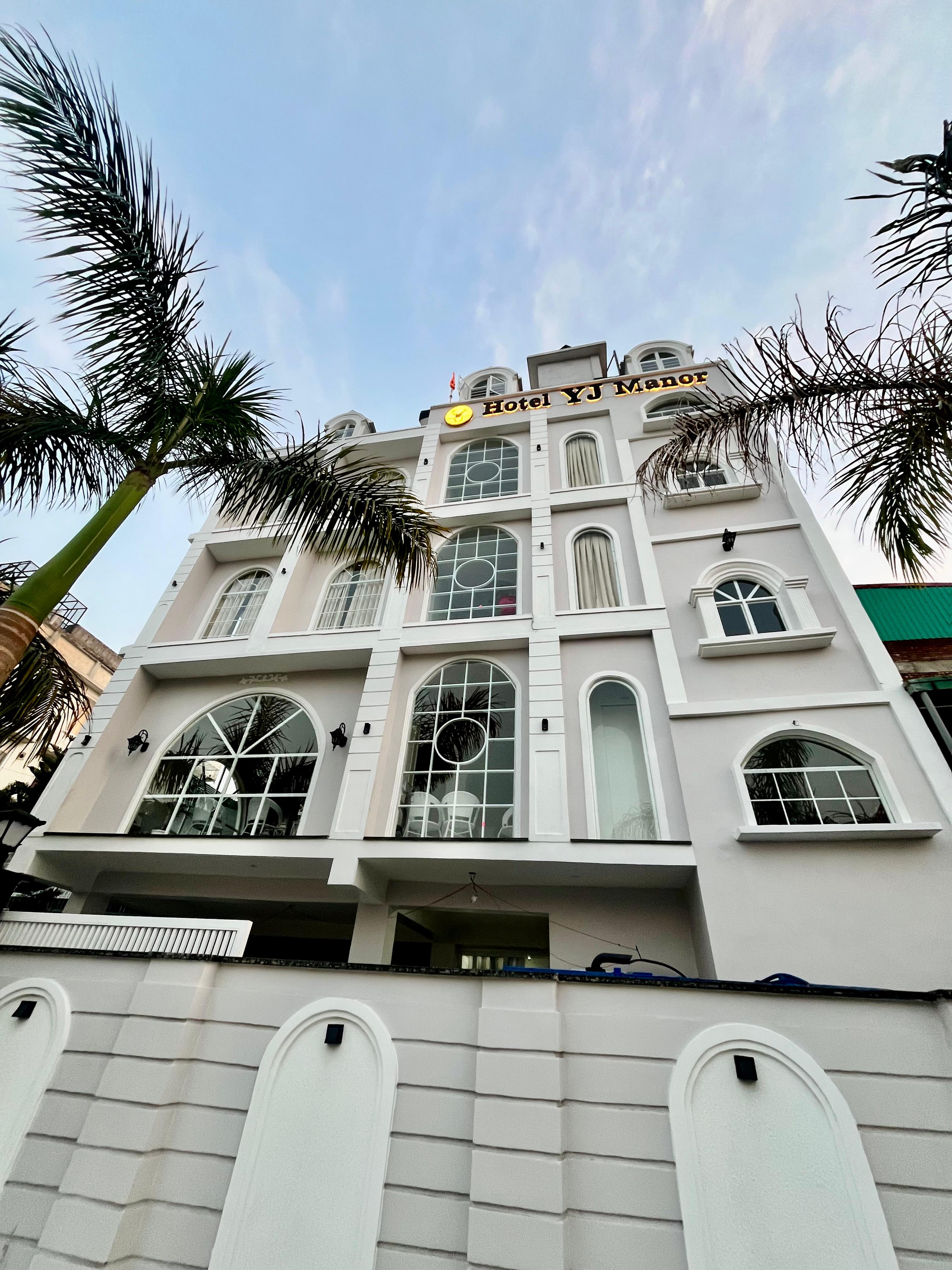 Hotel YJ Manor - Tap to explore photos