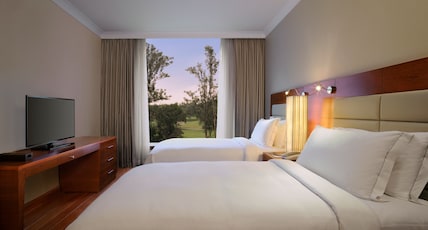 Hilton Bangalore Embassy GolfLinks Room Type - Two Bedroom Deluxe Suite with Kitchenette, Bathtub & Cocktail hours Hilton Bangalore Embassy GolfLinks Room Type - Two Bedroom Deluxe Suite with Kitchenette, Bathtub & Cocktail hours