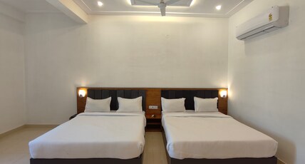 Shri Ram Portico Room Type - Deluxe Family Room ( 2 Double Bed | 4 Pax )
