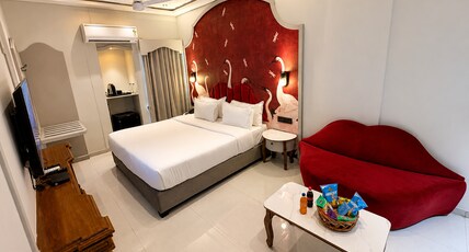Hotel Nova Bloom Room Type - Premium Couple Suite with Lip Sofa & 43 Inch Smart Android T.V. for Netflix and Chill Hotel Nova Bloom Room Type - Premium Couple Suite with Lip Sofa & 43 Inch Smart Android T.V. for Netflix and Chill