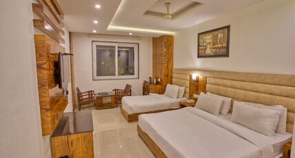 Height View Residency Room Type - Premium Triple Bedroom with City View and Working Desk