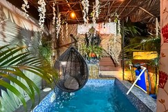 Address of Volcastay village hut with projector balcony  pool