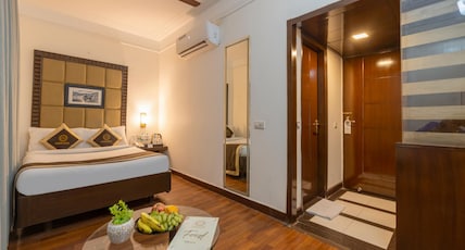 Foxoso The BMK Hotel, GK-1 Room Type - Deluxe Room with Smart TV Foxoso The BMK Hotel, GK-1 Room Type - Deluxe Room with Smart TV