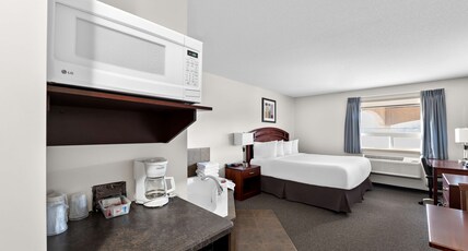 SureStay Plus Hotel by Best Western Hardisty Room Type - Suite-1 King Bed, Non-Smoking, Flat Screen Television, Hot Tub, Microwave And Refrigerator, Full Bre