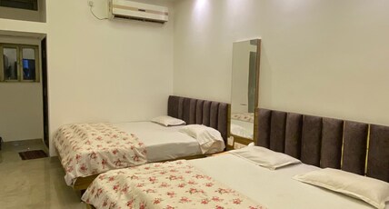 Hotel Shrinathji Room Type - King size Four Bedded  AC