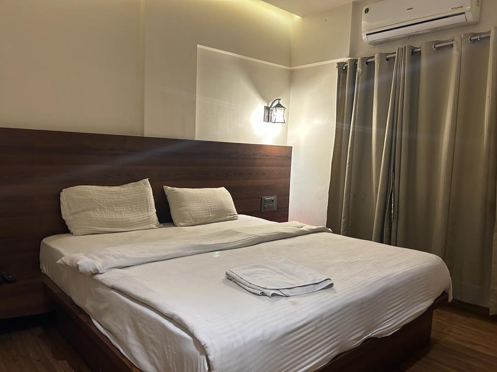 Omkar Inn - Tap to explore photos
