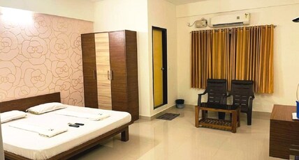 Radha Residency Room Type - Large Double Room AC