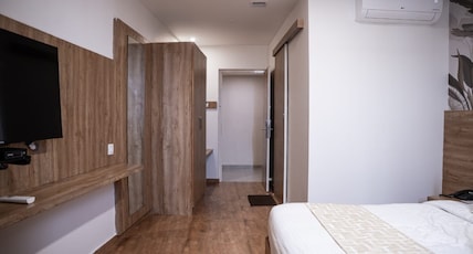 Oasis Suites Room Type - Deluxe King AC Room Oasis Suites Room Type - Deluxe King AC Room
