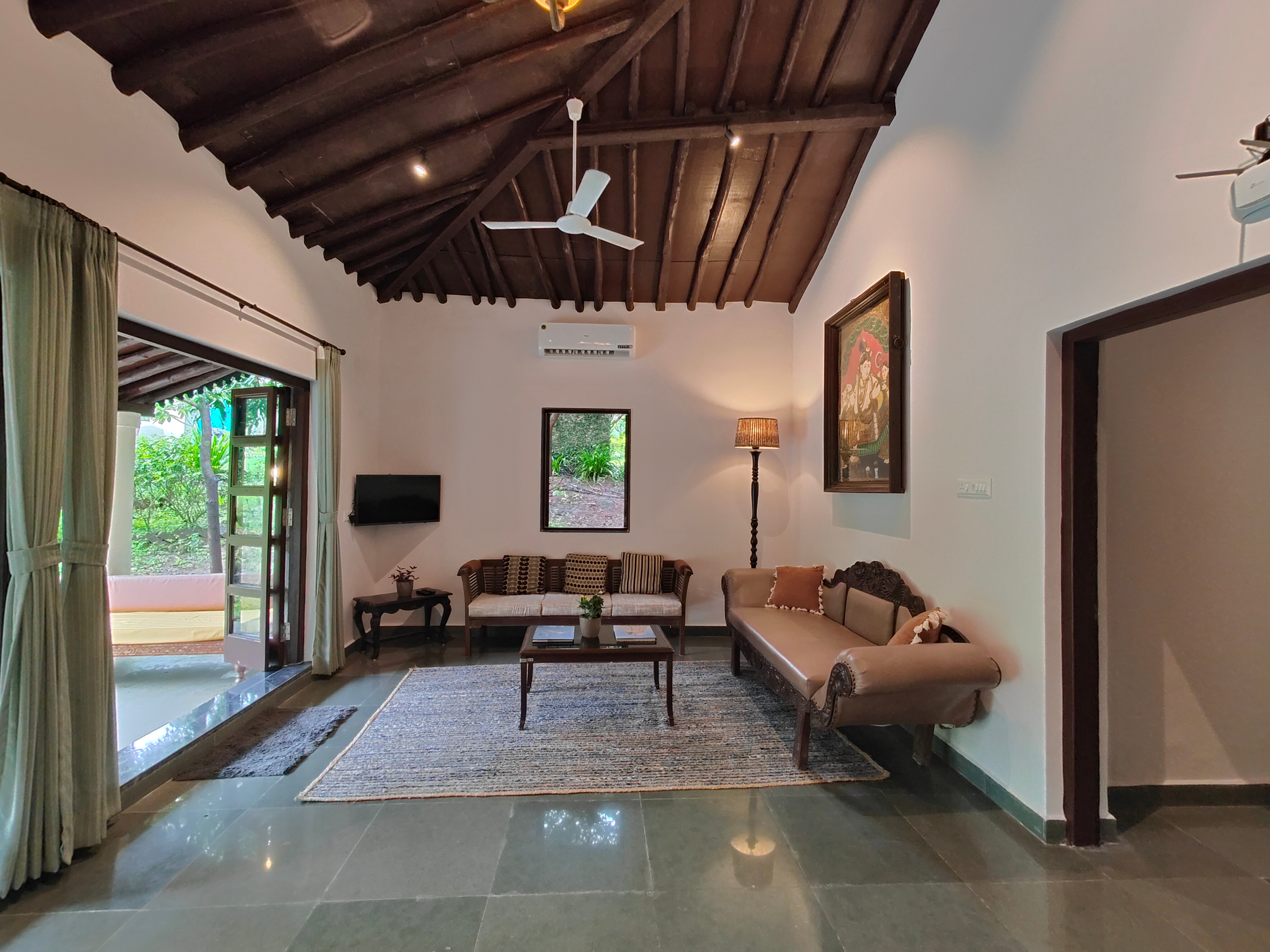 SaffronStays Mango Huts by the river - Tap to explore photos
