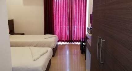 Trium Resorts Room Type - Standard Twin Bed AC