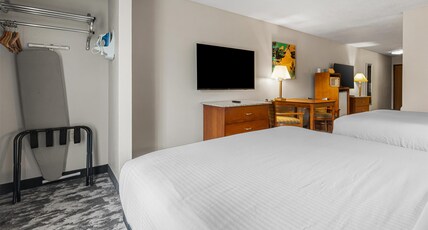 Best Western Ambassador Inn & Suites Room Type - 1 King 2 Queen Beds, Non-Smoking, High Speed Internet Access, Microwave And Refrigerator, 2 Flat Scr