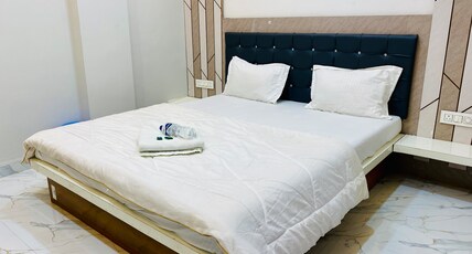Maa Narmada Hotel & Family Restaurant Room Type - Deluxe Double Room