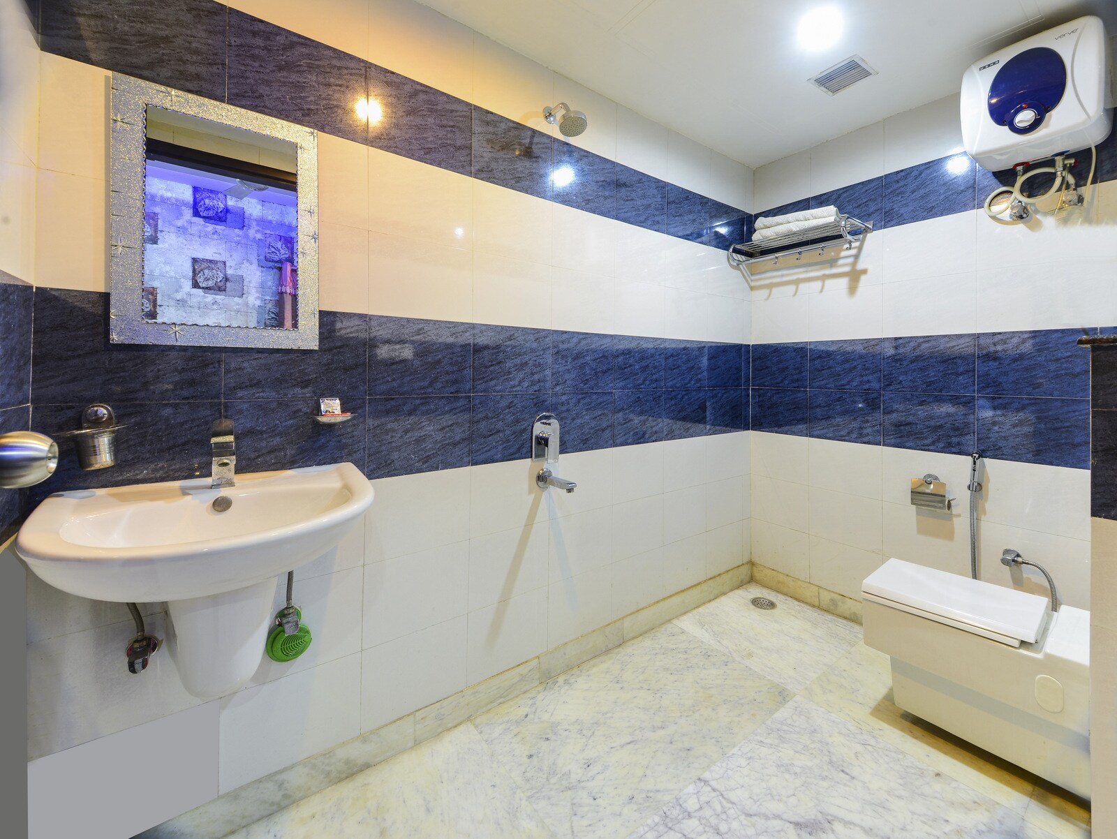 Hotel The Tezo Residency - Tap to explore photos