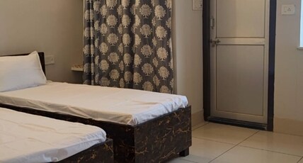 Ridhaaro Residency Room Type - Bedroom 1