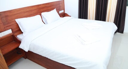 Naimithra Homestay Room Type - Deluxe Room