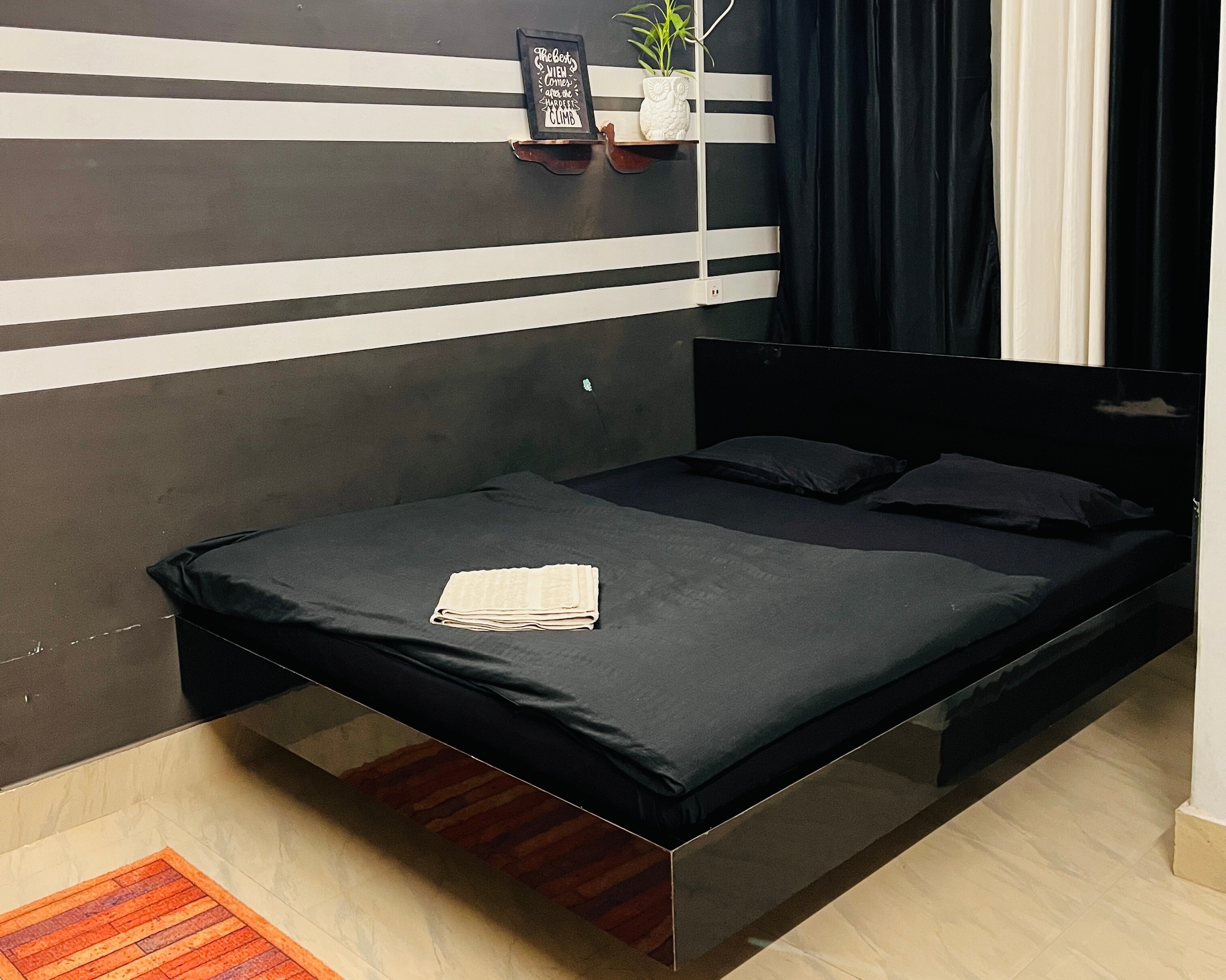BLACK AND WHITE STUDIO BY SWARGADEO INN - Tap to explore photos