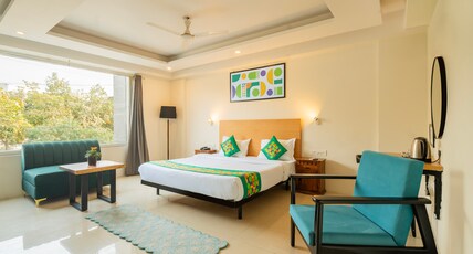 Treebo Twin Tree Suites Room Type - Deluxe Family Room