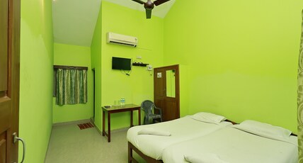 Caphina Coastal Comforts Room Type - Deluxe AC Room