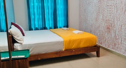 Red Poppy Home Stay Room Type - Deluxe AC Family Room
