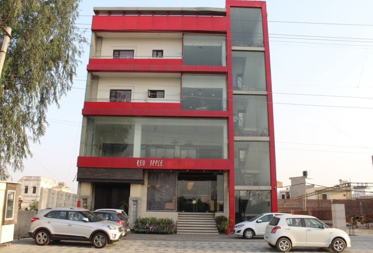 Red Apple Hotel  - Tap to explore photos