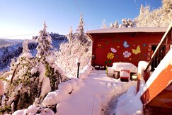 Way Wood Wind Lodge | Rooms in a Cottage