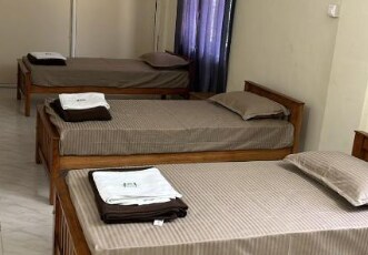 TGM INN Room Type - Deluxe Room with AC (3 SINGLE BEDS)