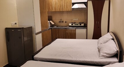 SunMoon Residency Room Type - Deluxe Four Bed Family Room with Window