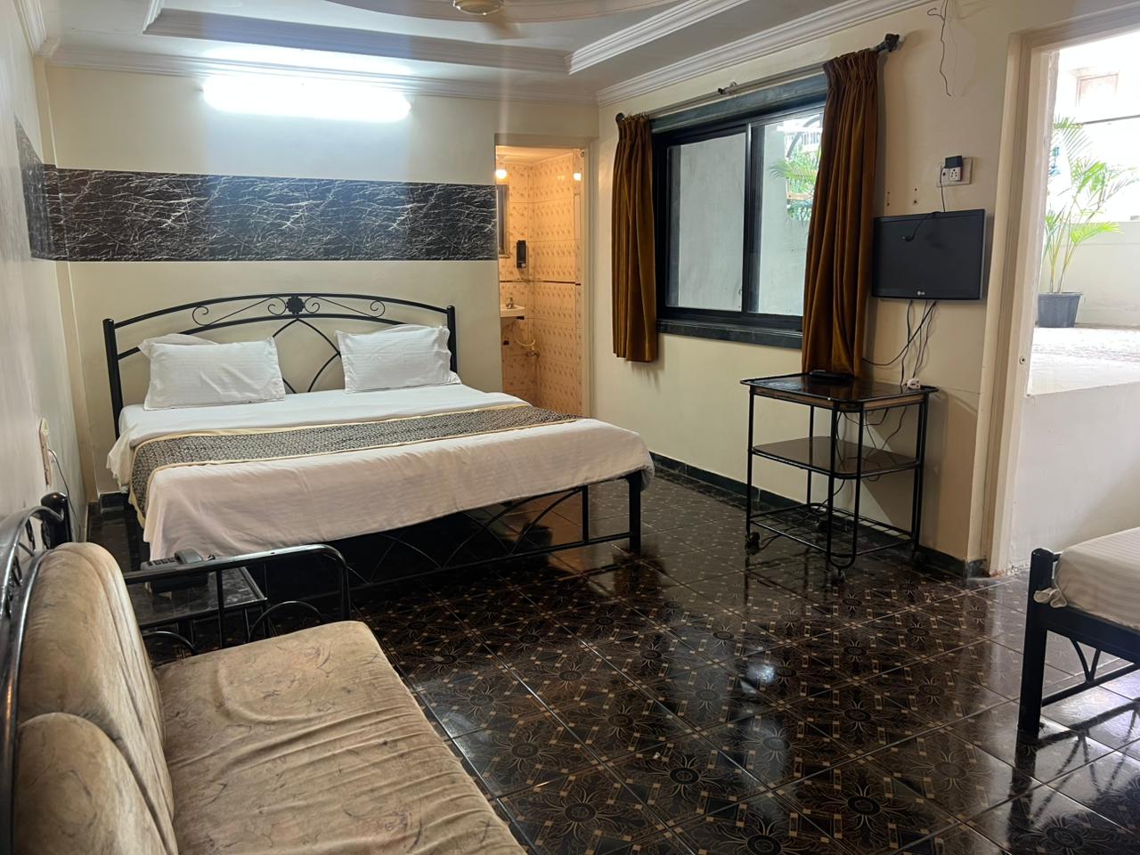 Hotel Sai's Village (101 meters from Saibaba Samadhi Temple) - Tap to explore photos