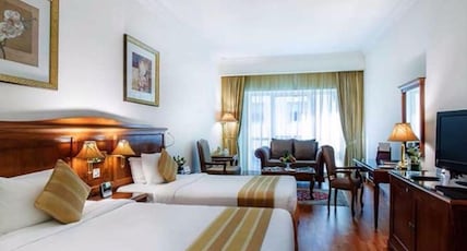 Grand Excelsior Hotel Bur Dubai Room Type - Family Suite Room with Living Area and Bathtub Grand Excelsior Hotel Bur Dubai Room Type - Family Suite Room with Living Area and Bathtub