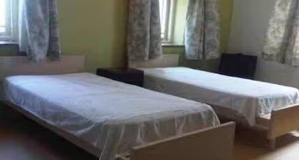 BLUE HOMES Room Type - Deluxe Triple Bed Non AC Room