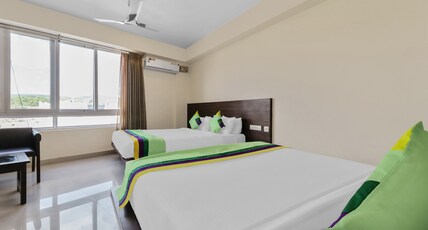 Treebo Punarnava Bypass Road Room Type - Deluxe Family Room