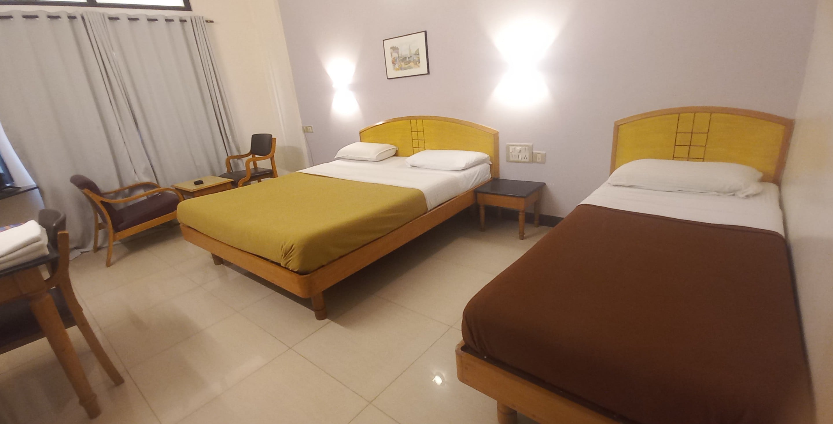 KAMAT EXECUTIVE INN - Tap to explore photos