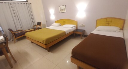 KAMAT EXECUTIVE INN Room Type - 3 BED AC..